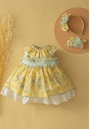 Vestido infantil con vuelo en color amarillo .Basmarti.