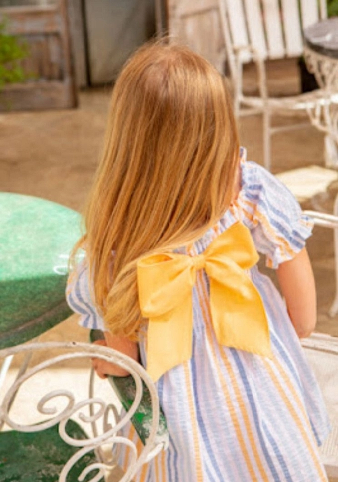 Vestido de rayitas con lazo.Coco Aqua.